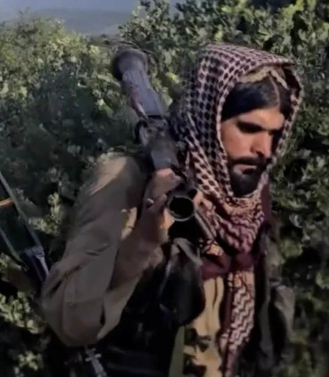 Frame at 05:17: RPG-7 launcher carried on the shoulder