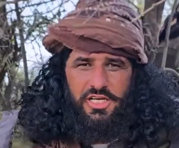 The man captioned as Ahmad Kazim at 2:03, brown turban