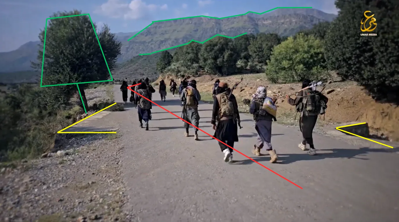 Frame at 06:55: Fighters walking along the road, with analyst markings