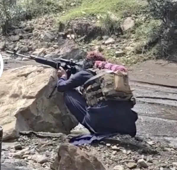 Frame at 04:43: SVD-pattern rifle aimed from behind a rock