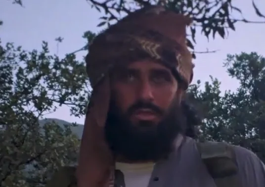 The man captioned as Ahmad Kazim at 5:50, brown turban