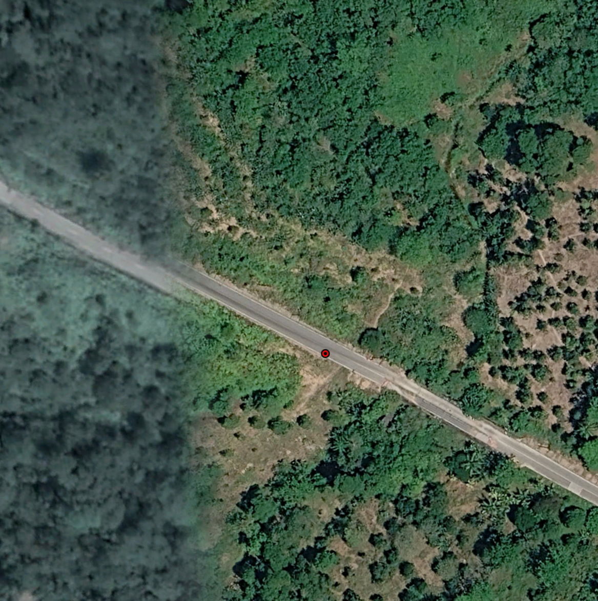 Google Earth ground-level view of the same stretch of Highway 5027, matching the road bend and vegetation in the official photograph.